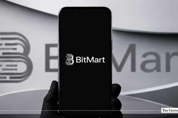 BitMart logo displayed on a smartphone against a blurred BitMart background