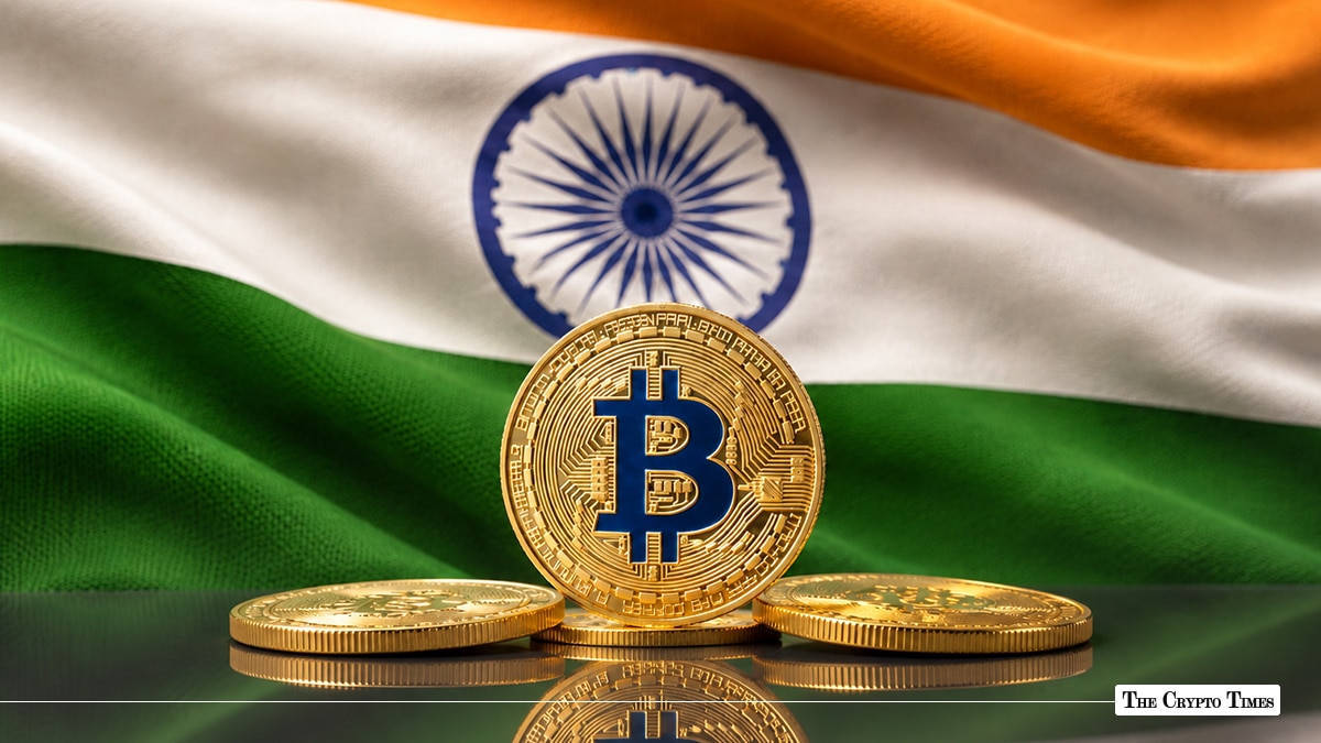 Bitcoin coin standing in front of the Indian flag