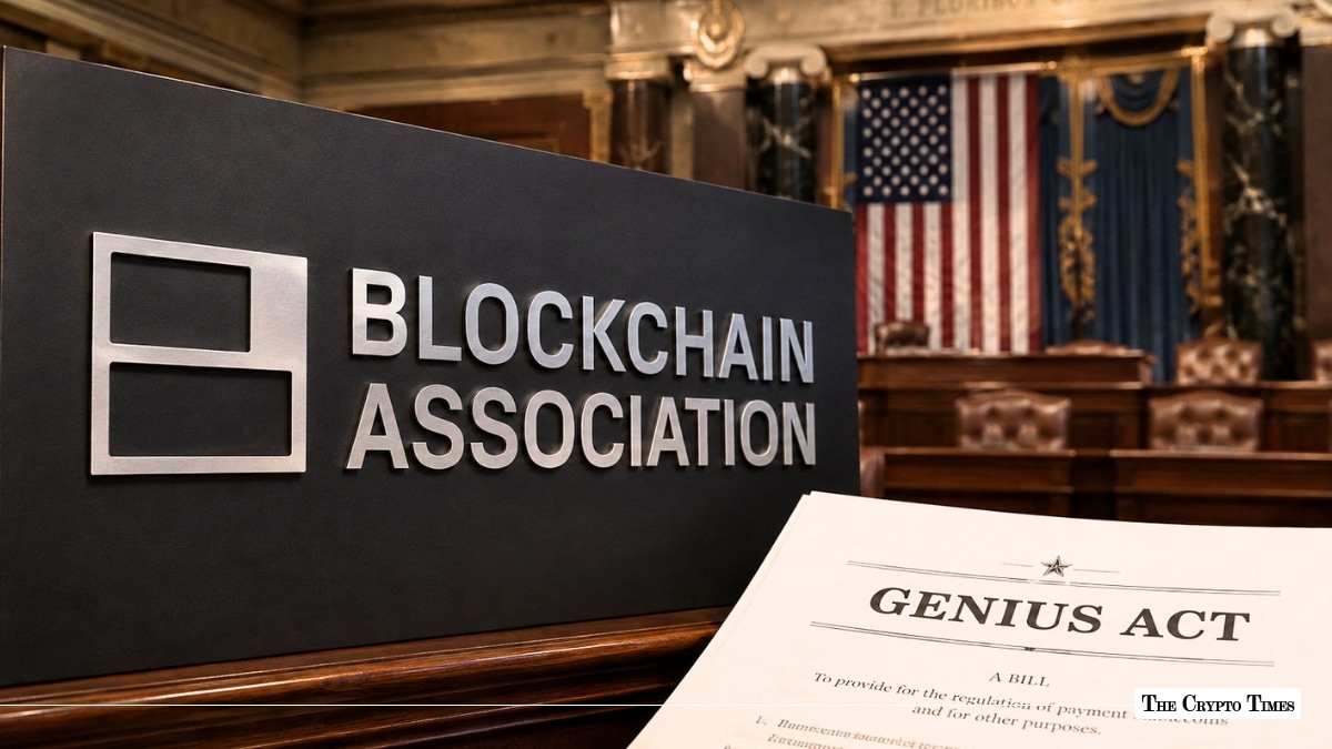 Blockchain Association sign next to a printed legislative bill titled "GENIUS ACT" with an American flag in the background