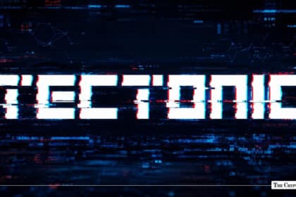 Glitchy, distorted white text reading "TECTONIC" set against a dark pixelated background