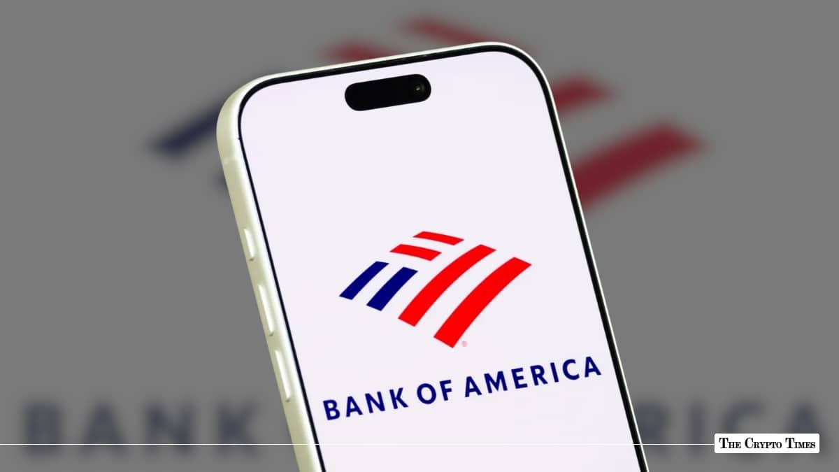 A smartphone displaying the Bank of America logo against a blurred corporate backdrop