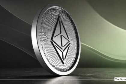 A Ethereum coin standing on a dark surface against a soft-lit background