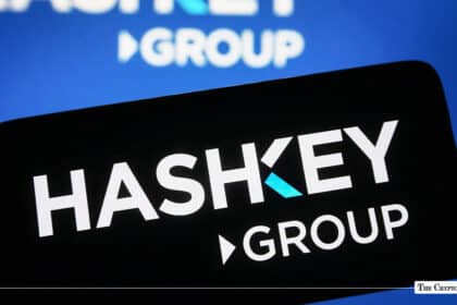 Smartphone displaying the HashKey Group logo against a blurred HashKey background