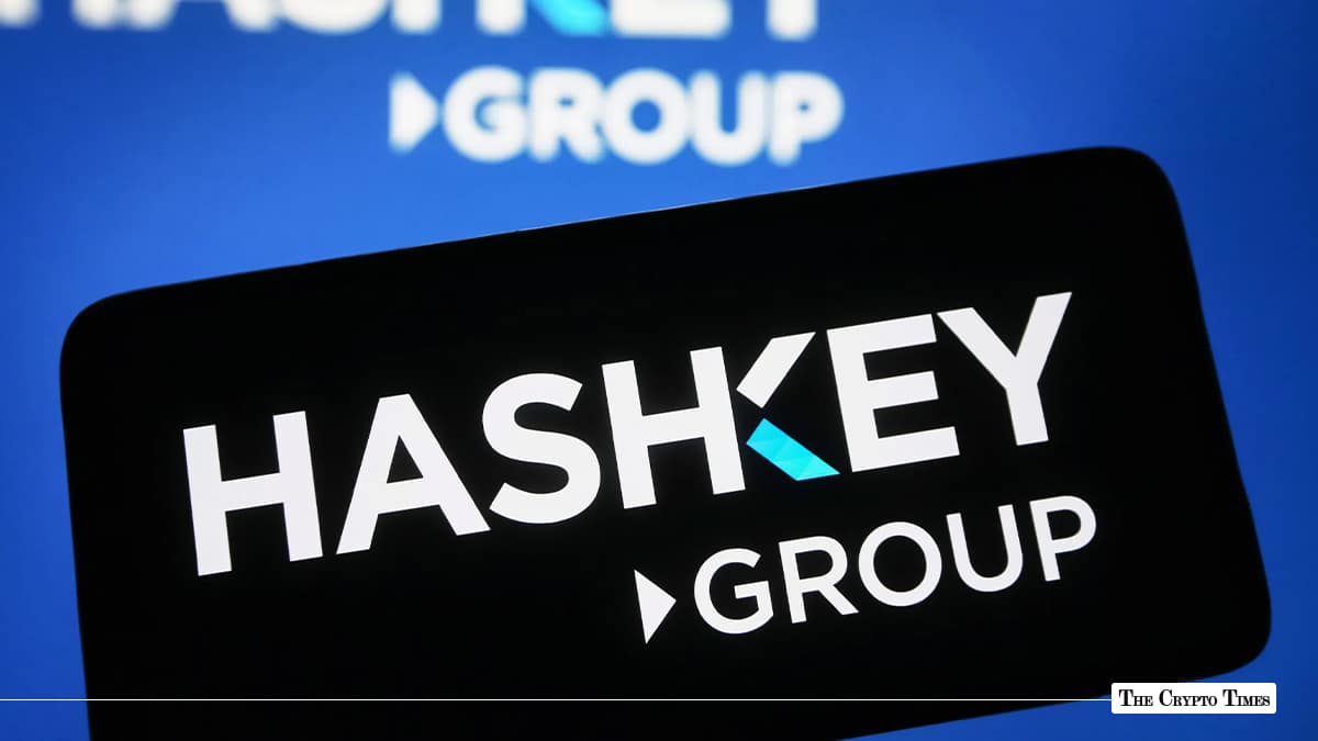 Smartphone displaying the HashKey Group logo against a blurred HashKey background