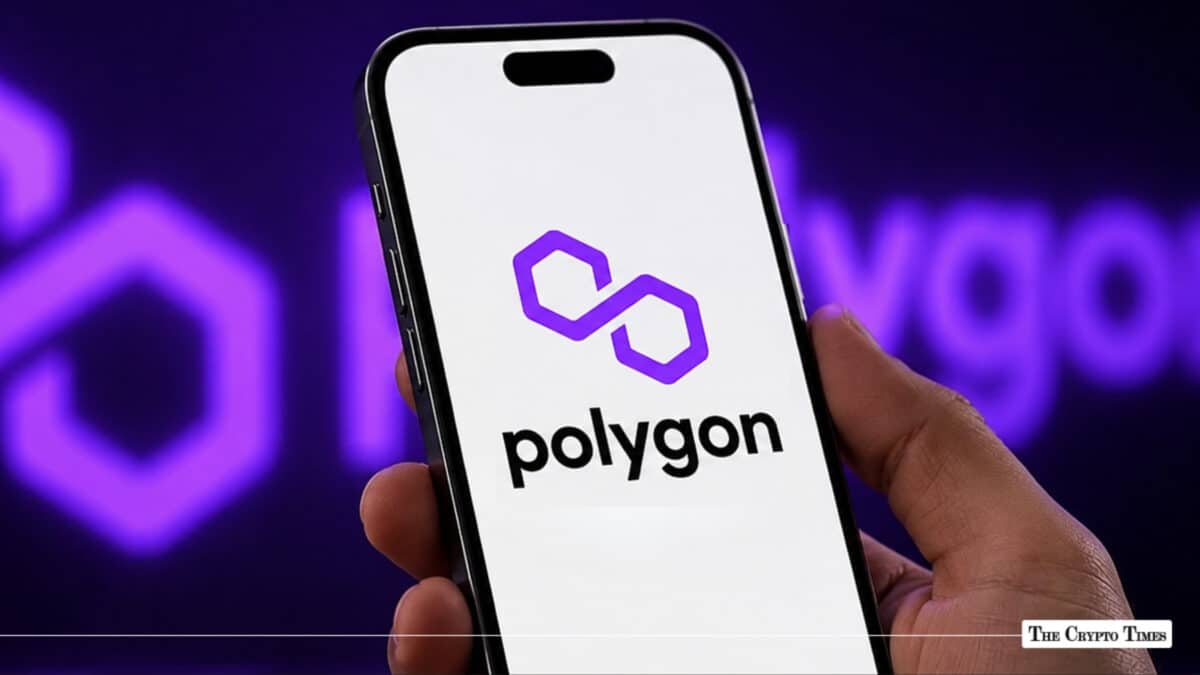 A hand holding a smartphone with the Polygon logo, representing the POL cryptocurrency market trends