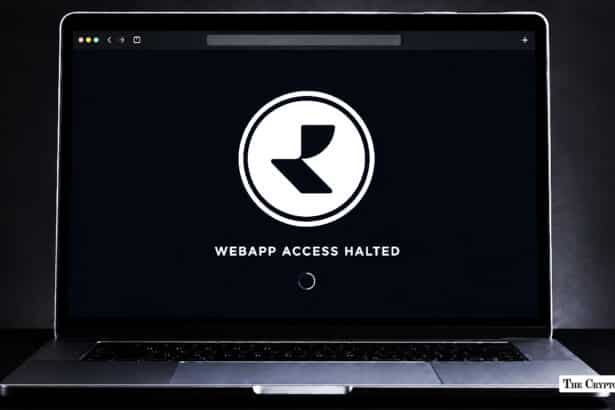 Laptop displaying the Realio logo alongside the message "WEBAPP ACCESS HALTED" on a black screen