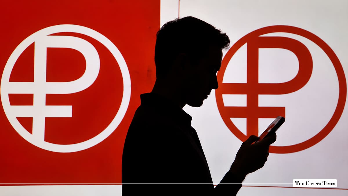 Silhouette of a person using a smartphone in front of large Digital Ruble symbol