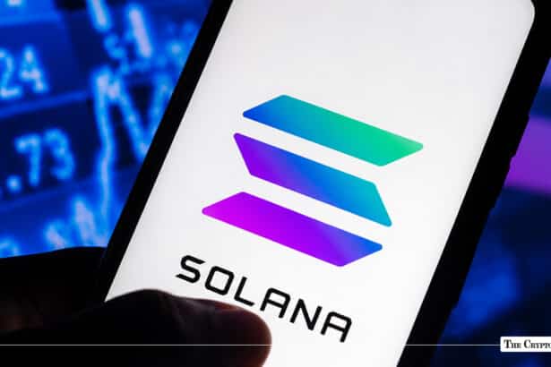 Smartphone screen showing the Solana logo against a blurred financial stock ticker background