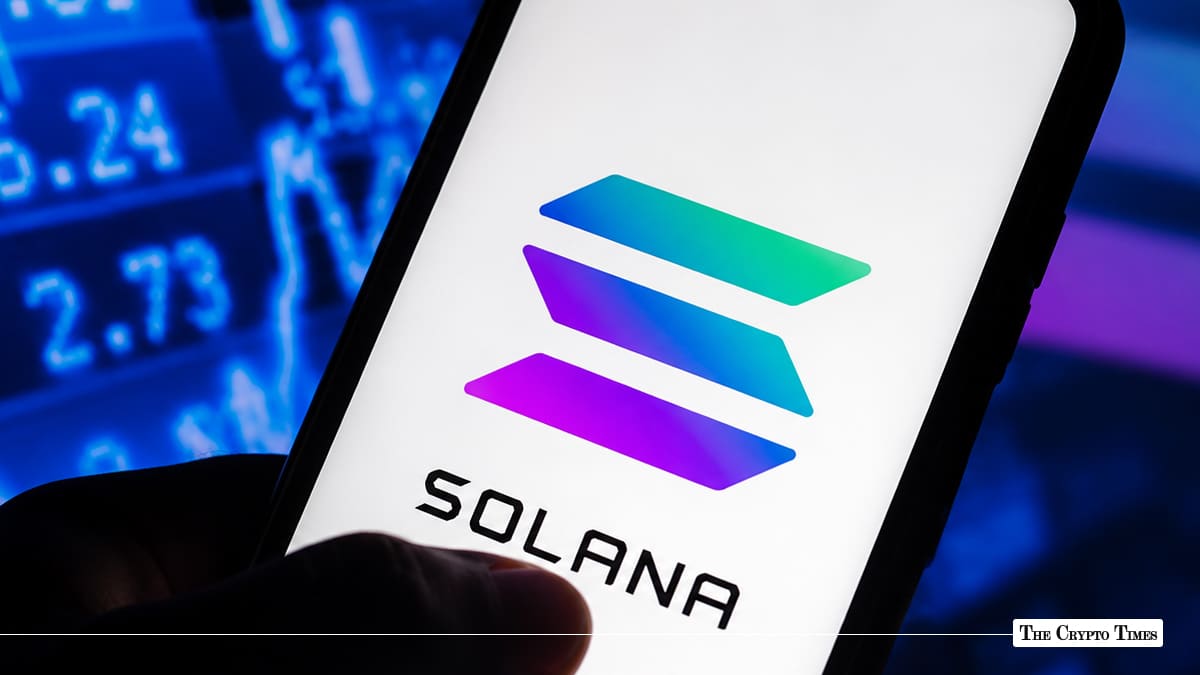 Smartphone screen showing the Solana logo against a blurred financial stock ticker background