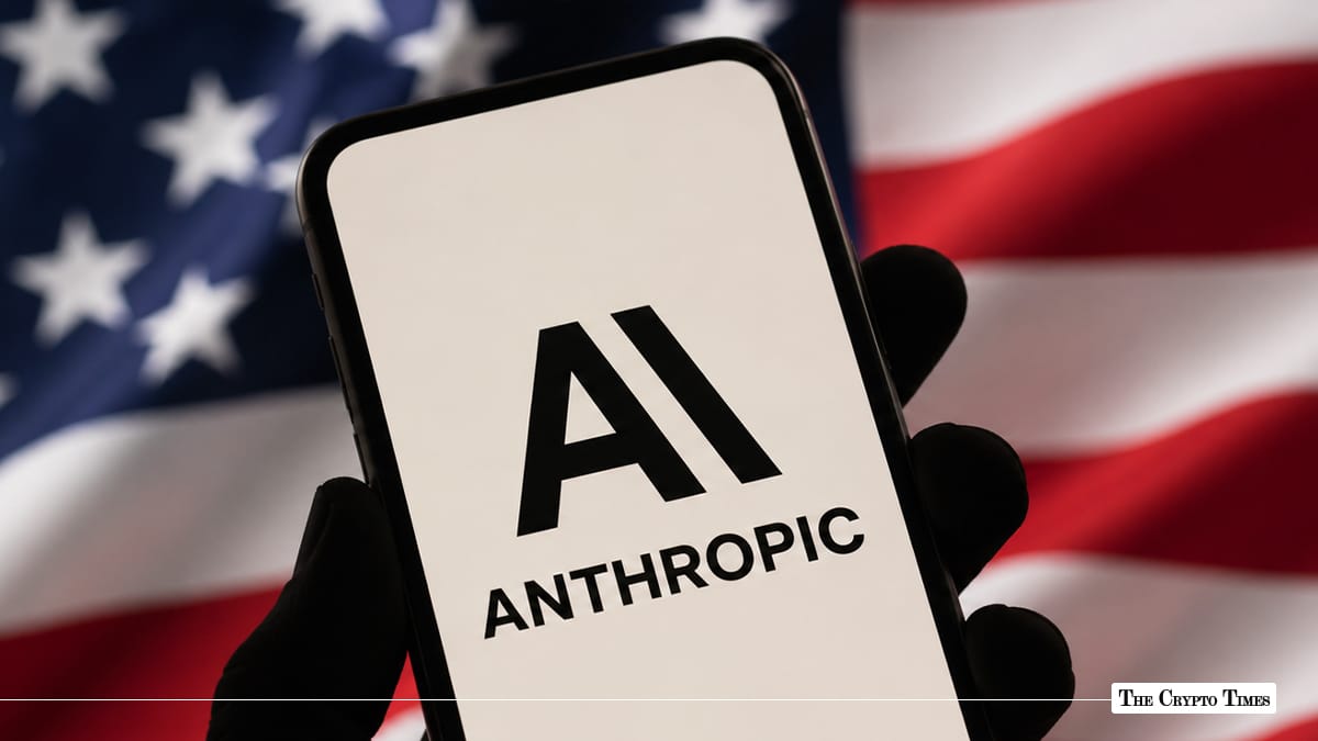 Black silhouette hand holding a smartphone displaying the Anthropic AI logo set against a blurred American flag background