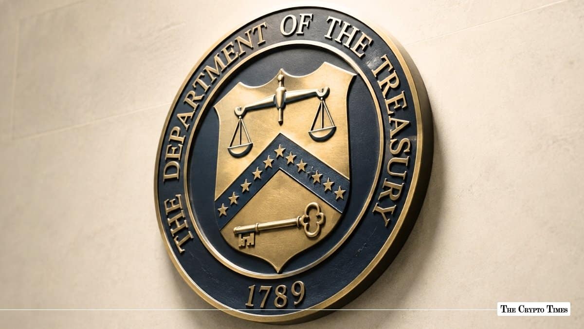 Bronze seal of The Department of the Treasury mounted on a light grey stone wall