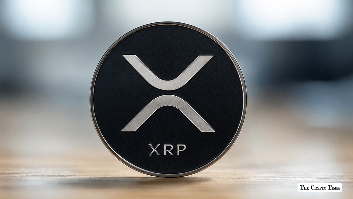 XRP coin with the XRP logo on a dark background.