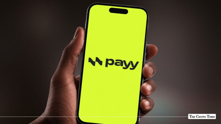 Smartphone displaying Payy app logo on a bright lime-green screen held in hand