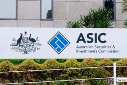 Large white outdoor sign displaying the Australian Securities & Investments Commission (ASIC) logo and text in front of a modern building facade
