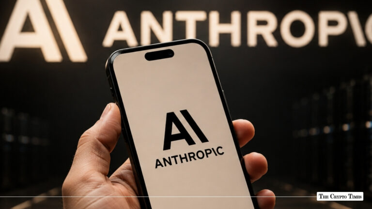 Hand holding a smartphone displaying the Anthropic logo on screen in front of a wall with the Anthropic logo