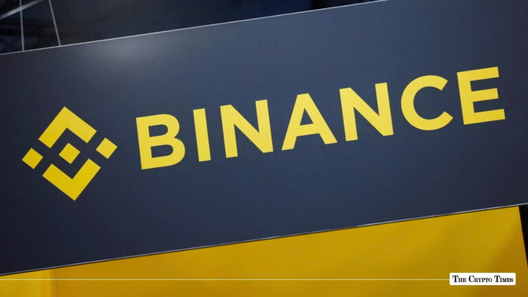 The yellow and black Binance logo displayed on a sign.