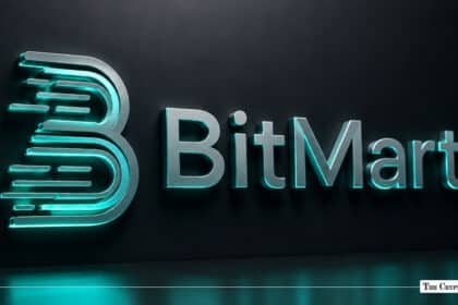 3D metallic silver BitMart logo with glowing cyan accent lighting mounted on a dark textured wall