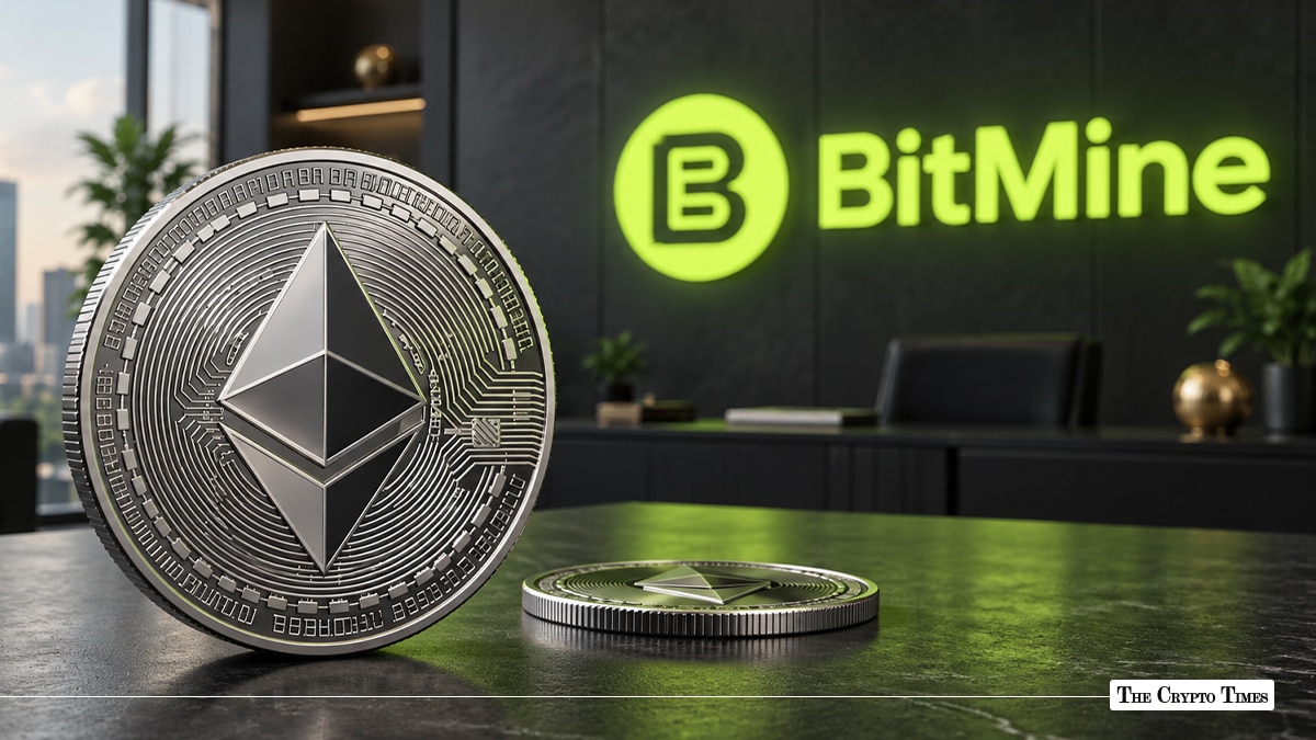 Silver Ethereum ETH coin standing on a desk with green glowing BitMine logo on office wall in background