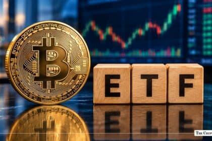 Gold Bitcoin (BTC) physical token placed next to wooden letter blocks spelling ETF.