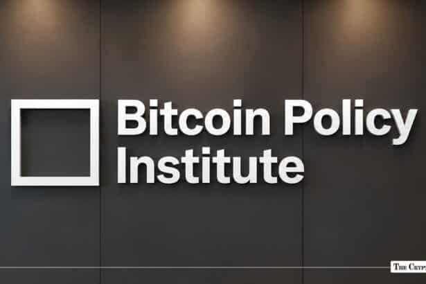 White Bitcoin Policy Institute 3D logo signage mounted on a dark office wall.