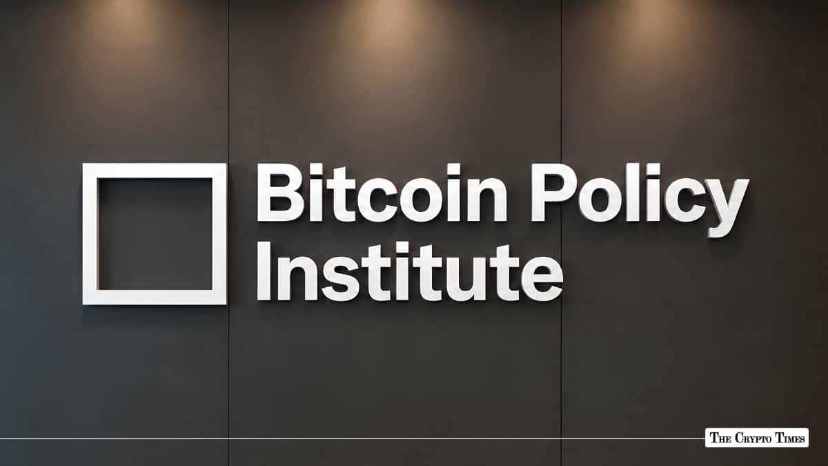 White Bitcoin Policy Institute 3D logo signage mounted on a dark office wall.