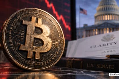 A physical Bitcoin coin in front of a red stock chart screen, alongside the CLARITY Act bill and the U.S. Capitol dome