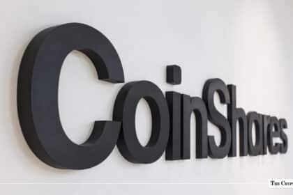 CoinShares logo displayed in black on a white wall.