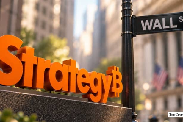 Orange MicroStrategy logo with a Bitcoin symbol next to a Wall Street sign.