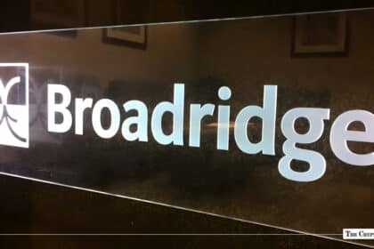 Illuminated glass sign displaying the white Broadridge logo.