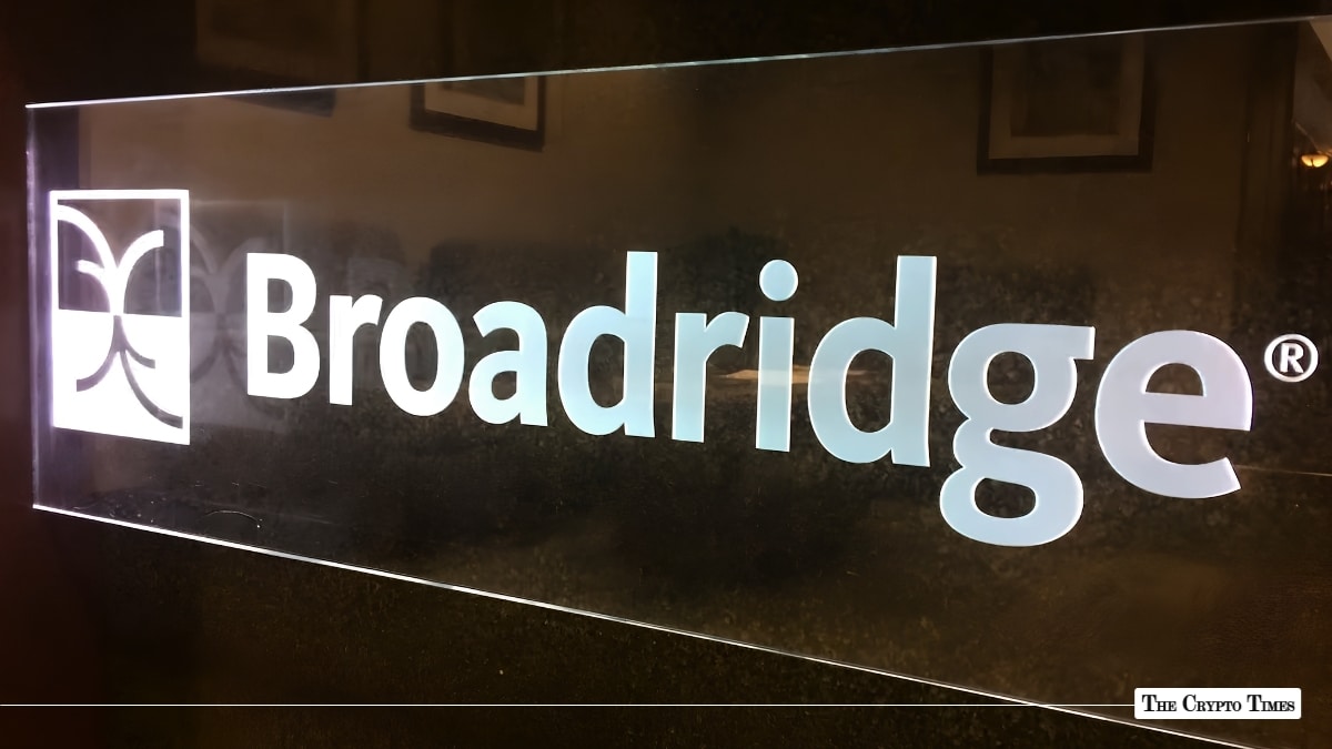 Illuminated glass sign displaying the white Broadridge logo.