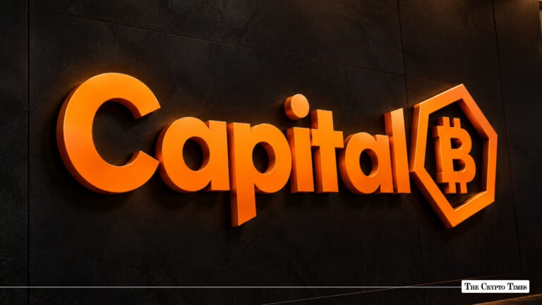 3D orange Capital B logo mounted on a dark textured wall