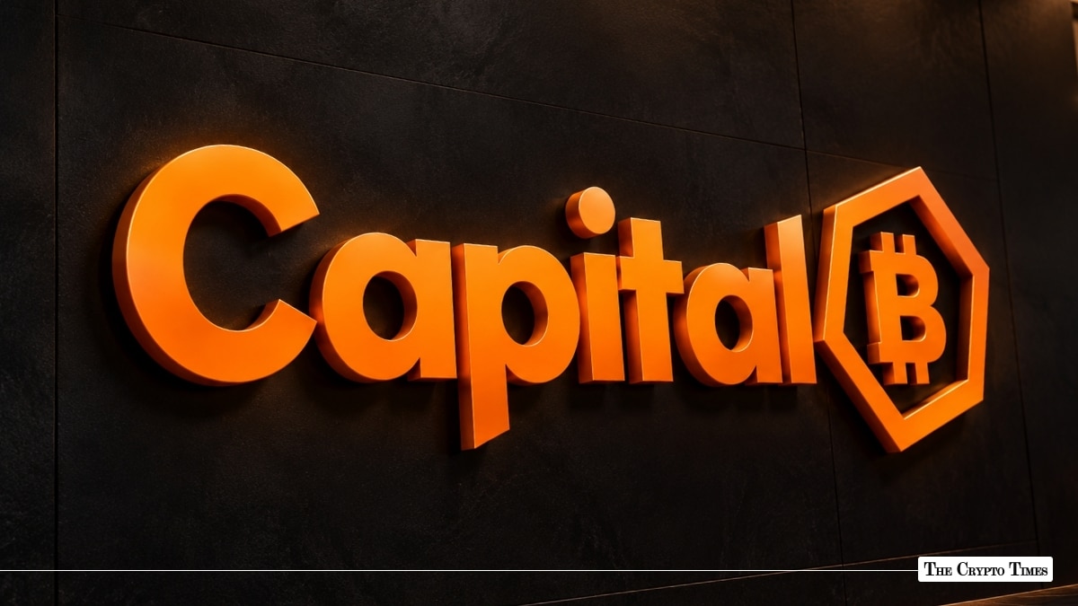 3D orange Capital B logo mounted on a dark textured wall