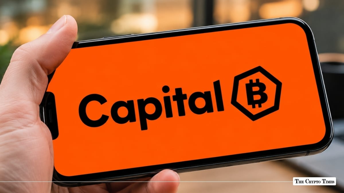 Smartphone displaying the Capital B logo with a Bitcoin emblem on a bright orange background