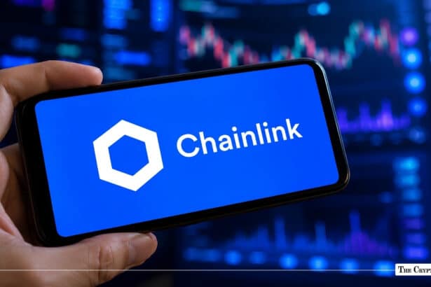 Chainlink cryptocurrency logo on a smartphone with a crypto market chart in the background