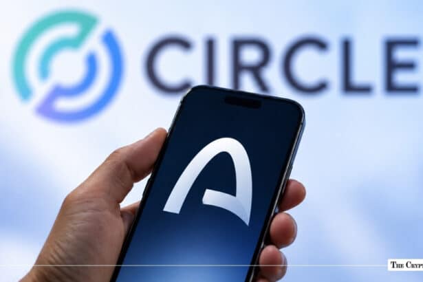 A hand holding a smartphone with the Arc logo in front of a blurred Circle company logo.
