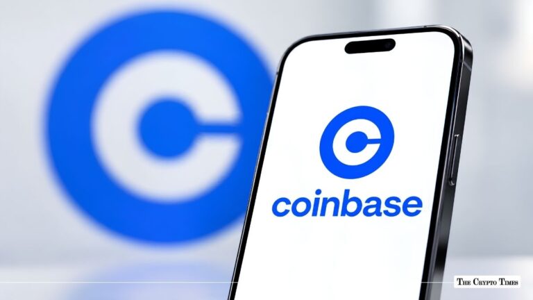 Smartphone displaying the Coinbase logo in front of a blurred Coinbase background.