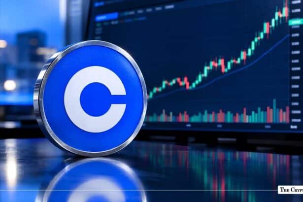 Physical coin featuring the blue Coinbase logo in front of a rising stock candlestick chart.