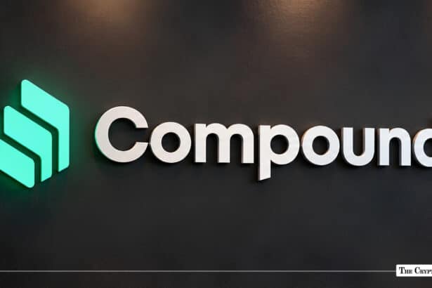 Compound logo on a dark wall.