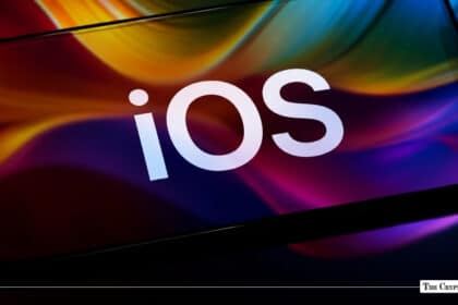 A smartphone displaying the iOS logo set against a colorful wavy background.