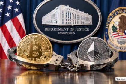 Gold Bitcoin and silver Ethereum coins locked in steel handcuffs in front of the U.S. Department of Justice seal and American flag