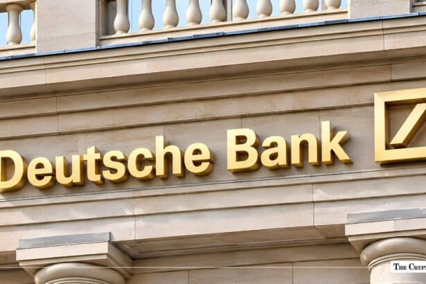 Deutsche Bank gold lettering mounted on a stone building facade.
