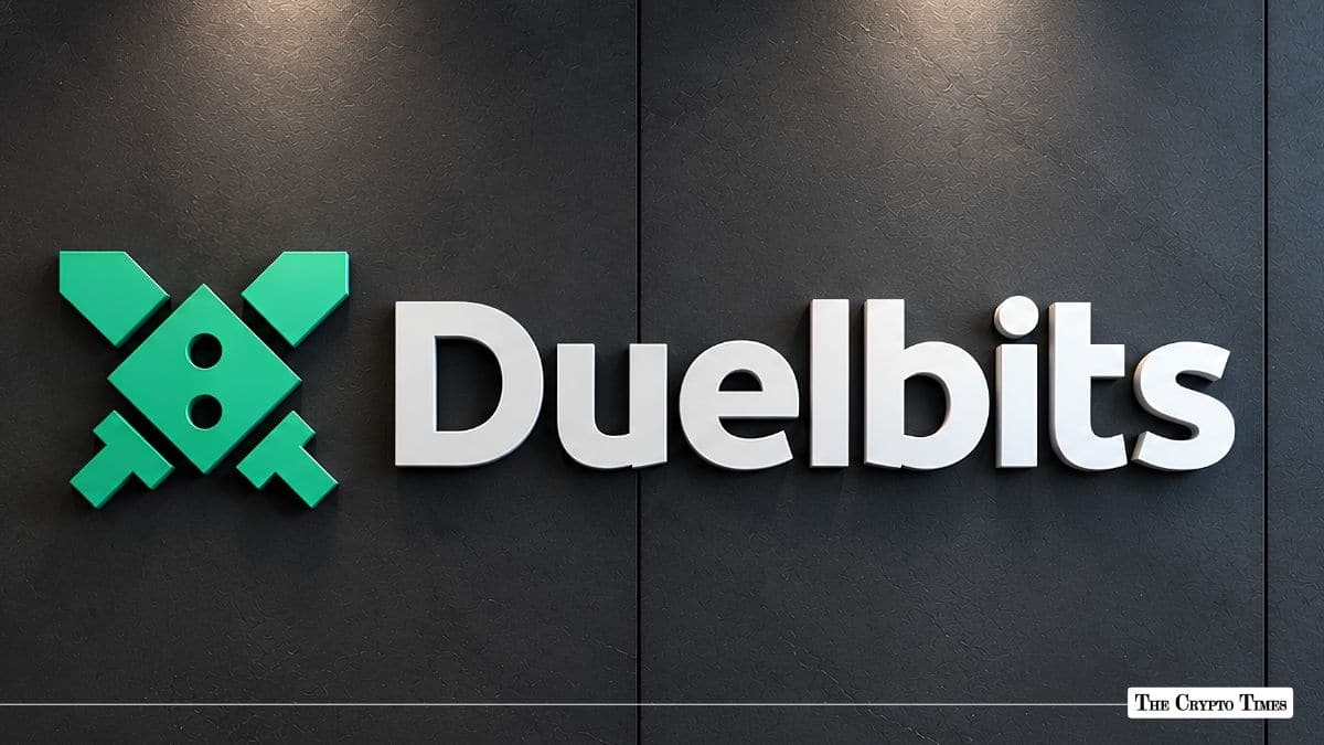 Duelbits corporate logo mounted on a dark interior wall.
