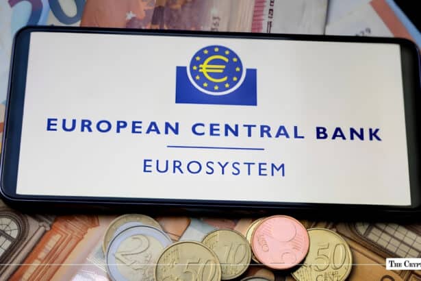 A smartphone displaying the European Central Bank Eurosystem logo placed over Euro banknotes and coins.