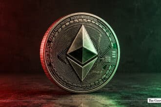 Silver Ethereum token standing upright, lit with red lighting on the left and green lighting on the right