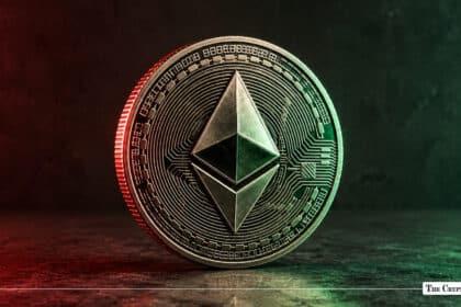 Silver Ethereum token standing upright, lit with red lighting on the left and green lighting on the right
