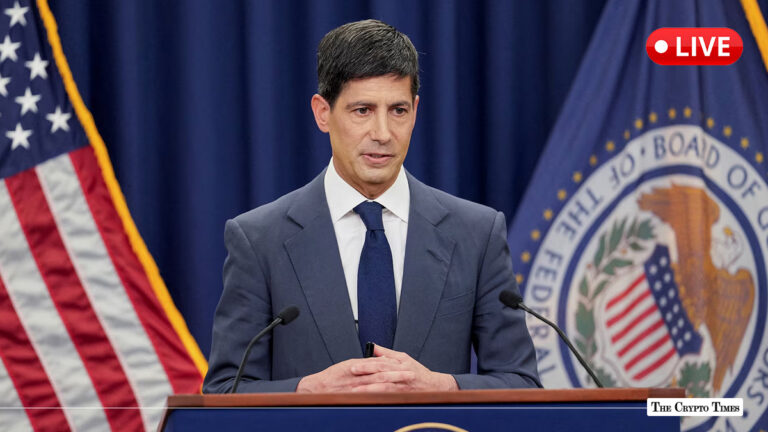 Federal Reserve official speaking at a podium during a live press conference.