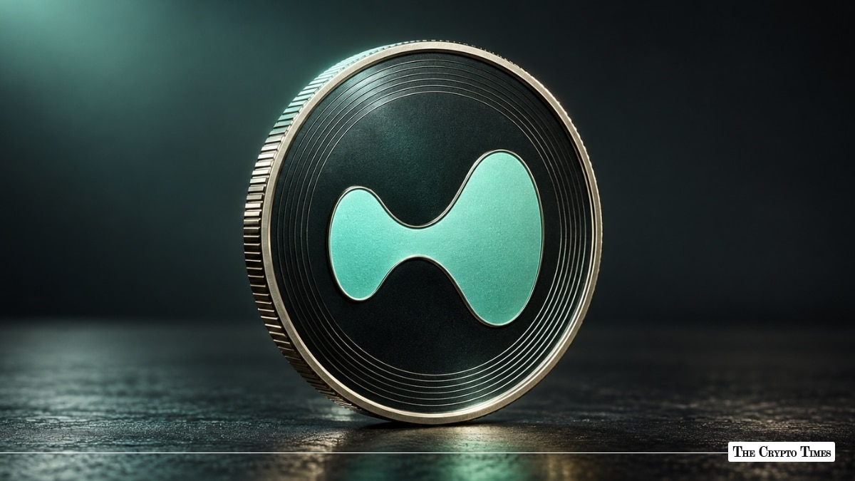 A metallic Hyperliquid (HYPE) coin with a green stylized symbol sitting on a dark surface.