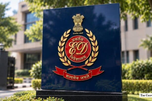 Official emblem of India's Directorate of Enforcement (ED) mounted on an outdoor monument plaque.