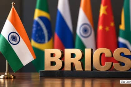 BRICS text sign in gold letters next to miniature flags of member countries including India, Brazil, Russia, China, and South Africa