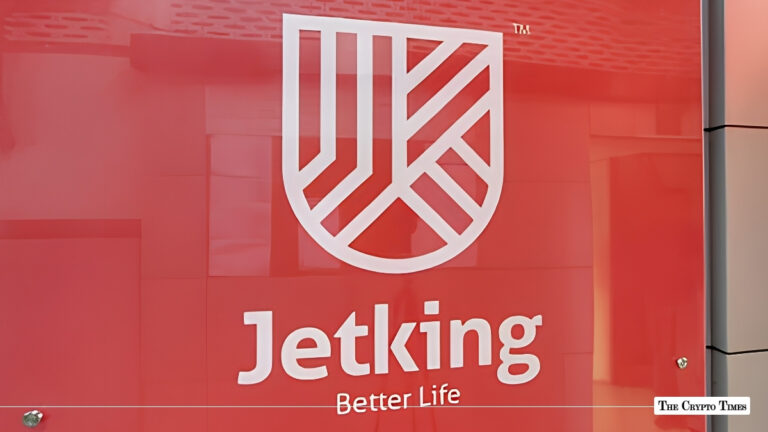 Jetking Infotrain corporate logo and shield emblem displayed on a red office wall background